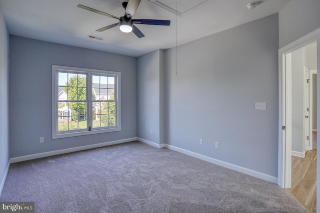 unfurnished room with light carpet and ceiling fan