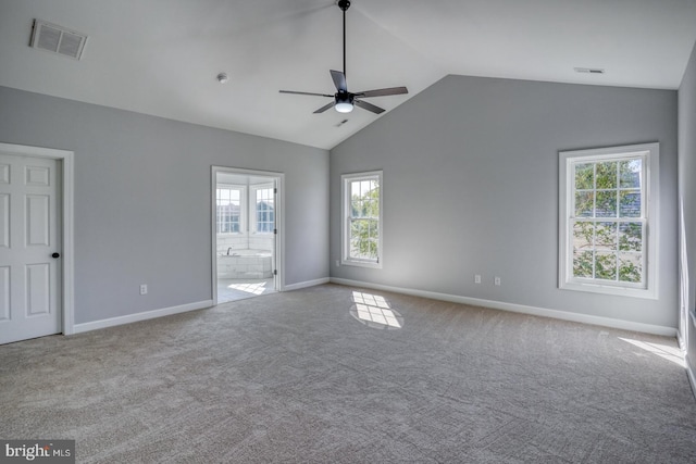 carpeted spare room with lofted ceiling and ceiling fan