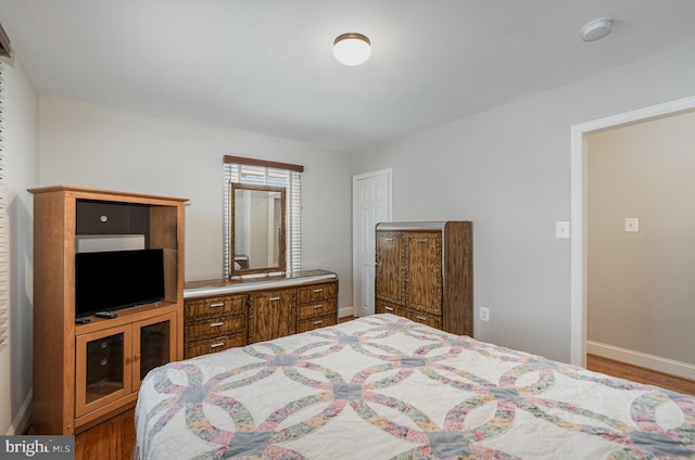 bedroom with wood-type flooring