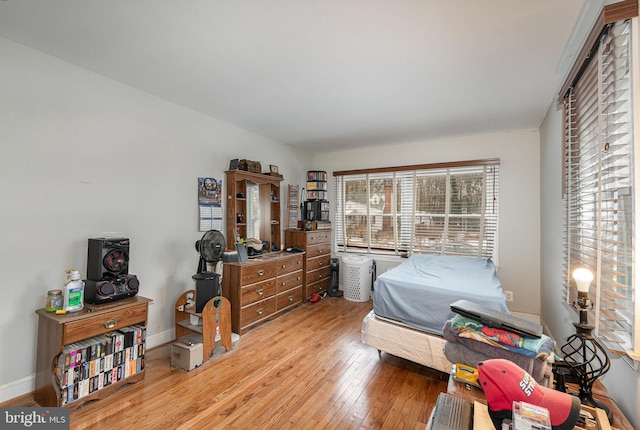 bedroom with light wood-type flooring