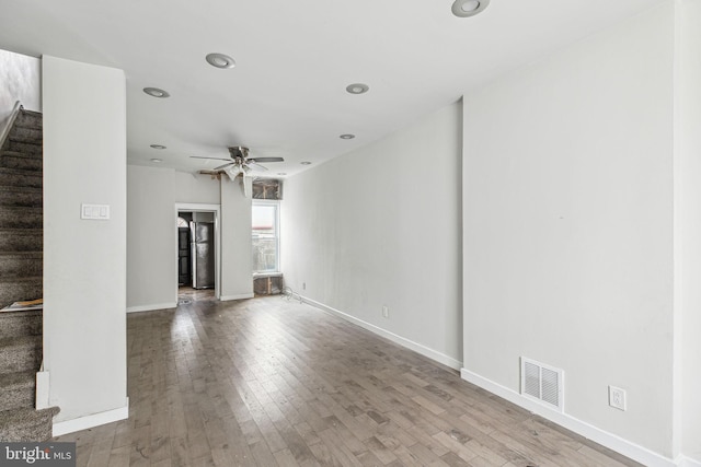 interior space with light wood-type flooring and ceiling fan