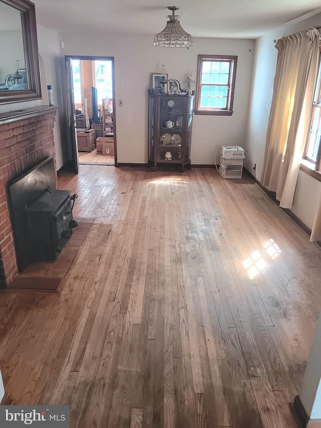 unfurnished dining area featuring light wood-type flooring