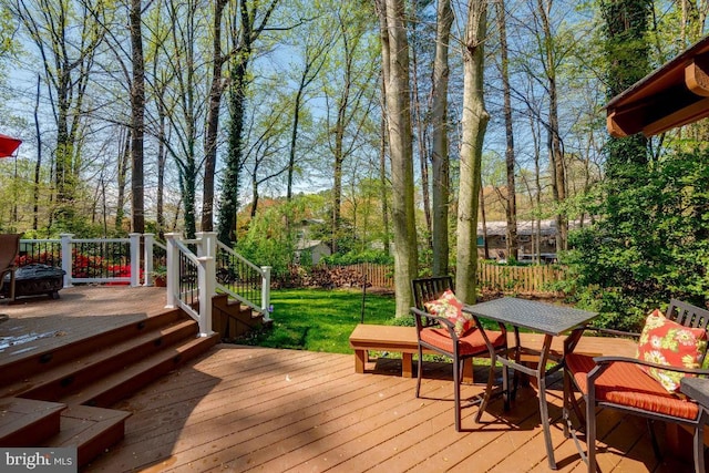 wooden terrace with a yard