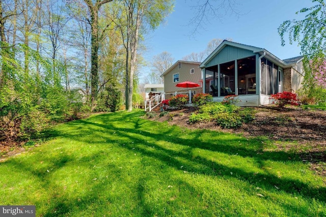 view of yard featuring a sunroom