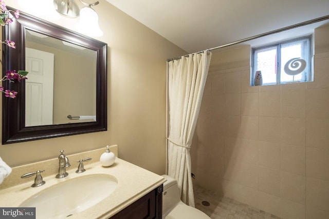 bathroom with vanity, a shower with curtain, and toilet