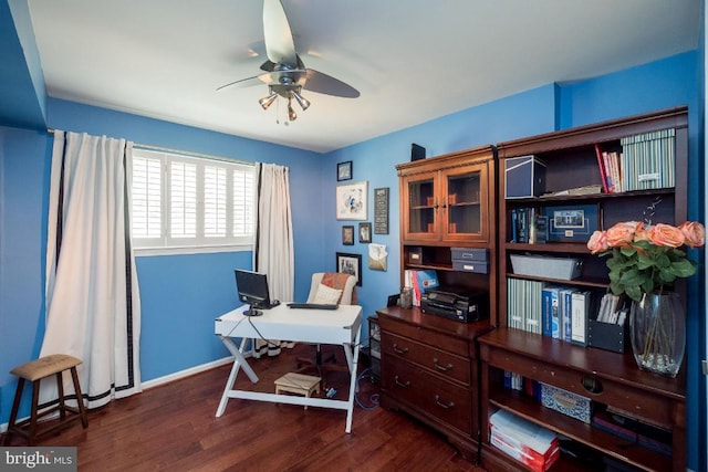 office space with dark wood-type flooring and ceiling fan