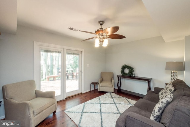 living room with hardwood / wood-style flooring and ceiling fan