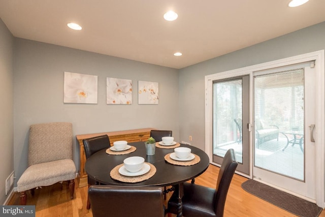 dining space featuring hardwood / wood-style flooring