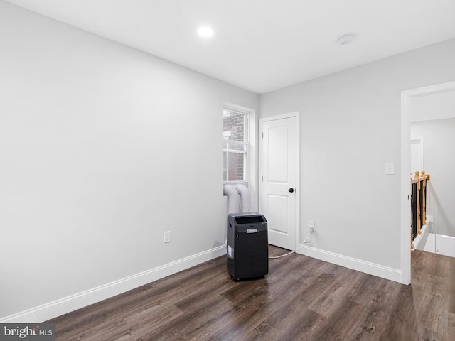 unfurnished bedroom featuring dark wood-type flooring