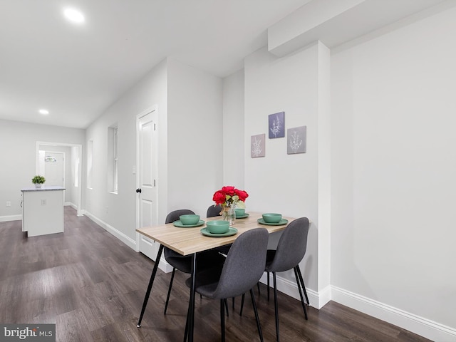 dining area featuring dark hardwood / wood-style floors