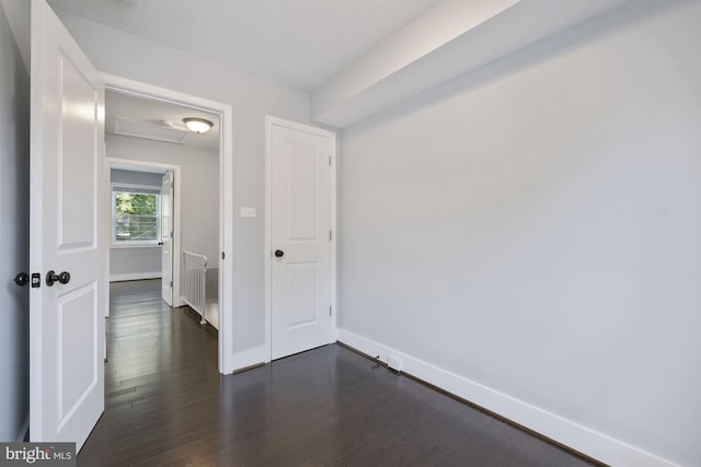 interior space with radiator and dark wood-type flooring