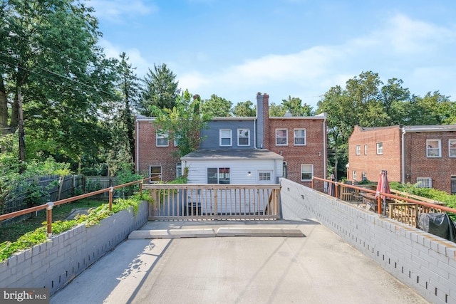 rear view of property with a deck