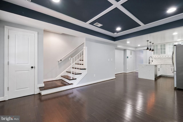 unfurnished living room with sink and dark hardwood / wood-style flooring