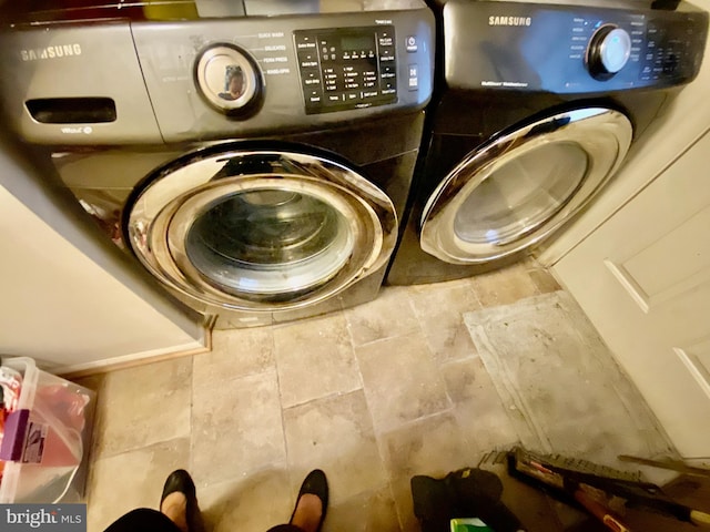 laundry area with independent washer and dryer