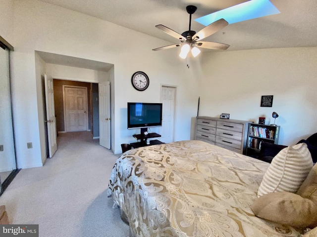 carpeted bedroom with lofted ceiling and ceiling fan