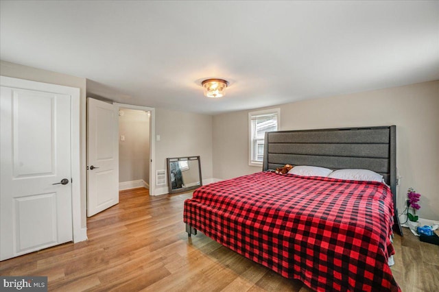 bedroom with light wood-type flooring