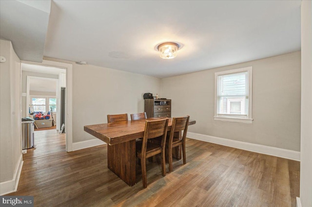 dining space featuring dark hardwood / wood-style flooring