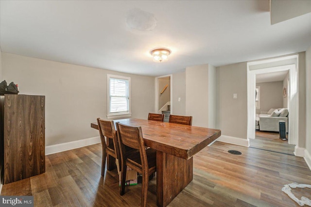 dining room with hardwood / wood-style flooring