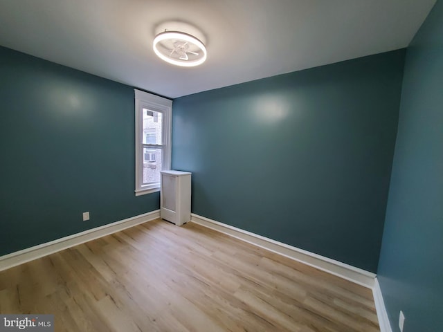 spare room with light hardwood / wood-style floors