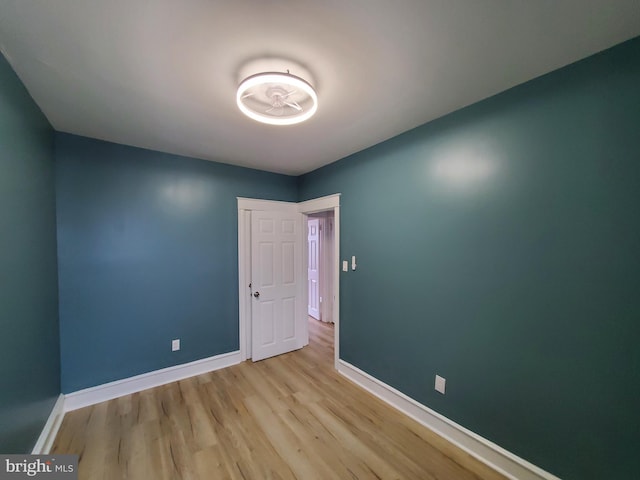 empty room with light hardwood / wood-style floors