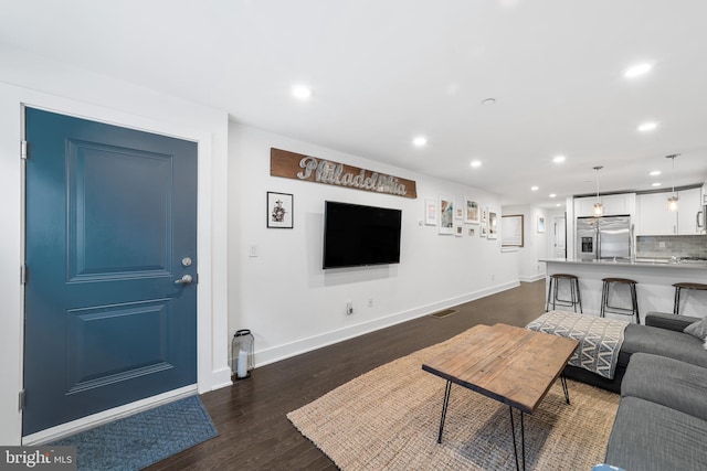 living room featuring dark hardwood / wood-style floors