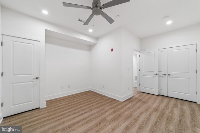 unfurnished bedroom with light hardwood / wood-style flooring and ceiling fan