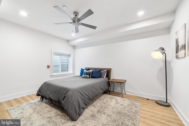 bedroom featuring wood-type flooring and ceiling fan