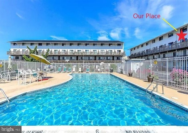 view of swimming pool with a patio area