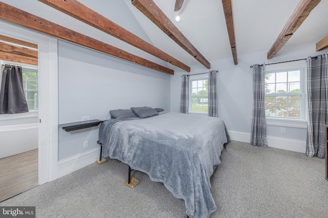 bedroom with light carpet and beam ceiling