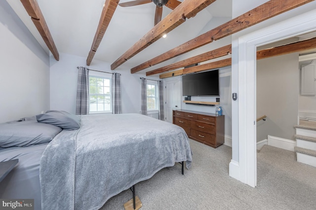 bedroom featuring beam ceiling, ceiling fan, and light colored carpet