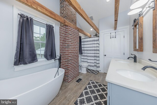 full bathroom featuring shower with separate bathtub, hardwood / wood-style floors, vanity, and toilet