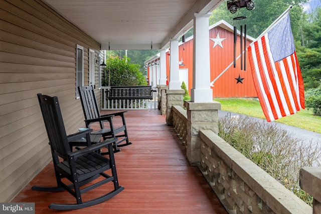 wooden terrace featuring a porch