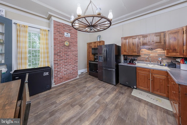 kitchen with decorative backsplash, dark wood-type flooring, black appliances, crown molding, and a chandelier