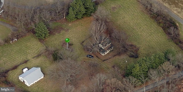 birds eye view of property with a rural view