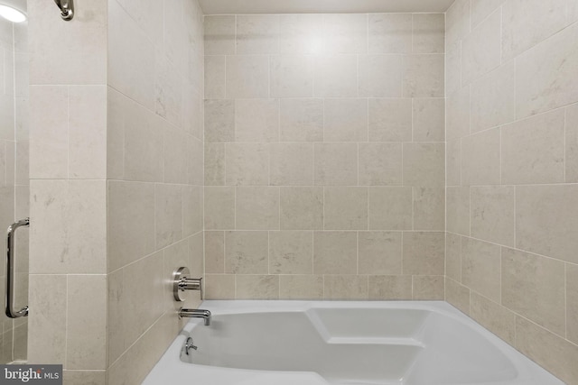 bathroom featuring a tub to relax in