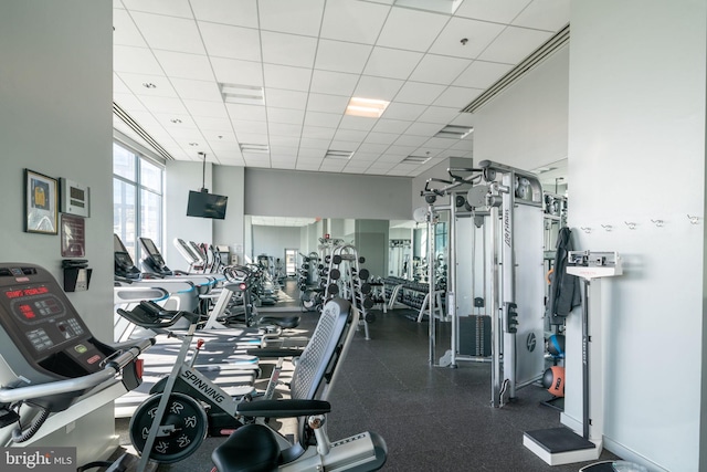 workout area with a paneled ceiling