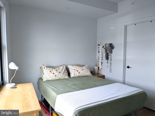 bedroom with wood-type flooring