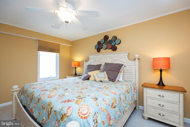 bedroom featuring ceiling fan, crown molding, and carpet