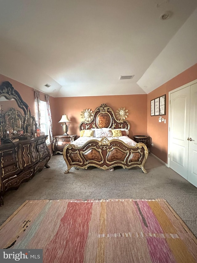 unfurnished bedroom with lofted ceiling and carpet floors