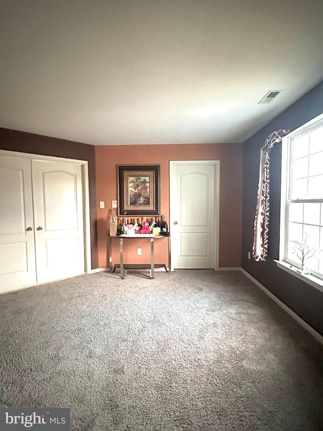 unfurnished bedroom featuring carpet floors