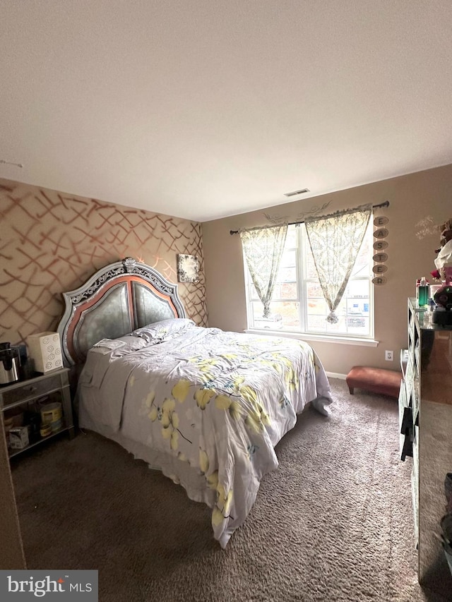 bedroom featuring dark colored carpet