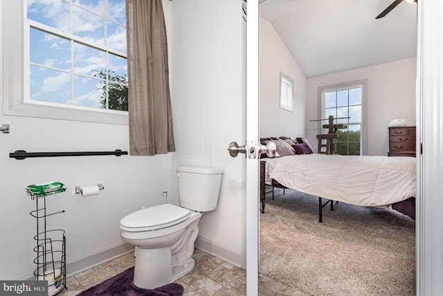 bathroom featuring ceiling fan, lofted ceiling, and toilet