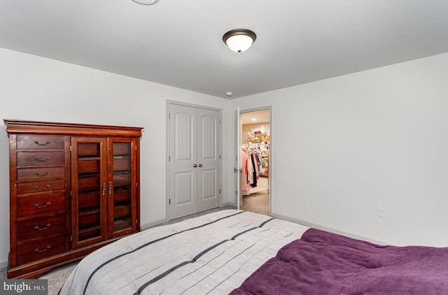 carpeted bedroom with a closet