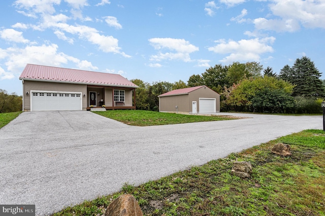 view of front of home with a garage and a front yard