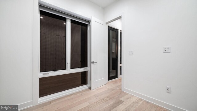 hallway featuring light wood-type flooring