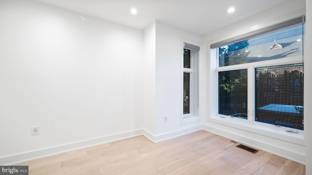 unfurnished room featuring light wood-type flooring