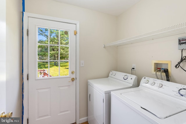 clothes washing area featuring washer and clothes dryer