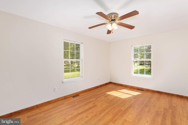 spare room featuring ceiling fan and light wood-type flooring