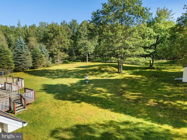 view of yard with a wooden deck