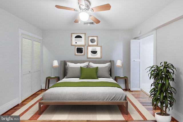 bedroom featuring ceiling fan, a closet, and hardwood / wood-style flooring